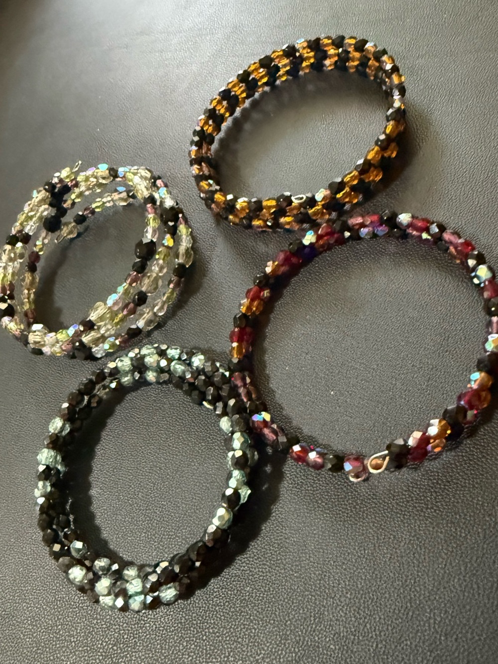 4 Bracelets - Memory-wire with sparkly glass beads